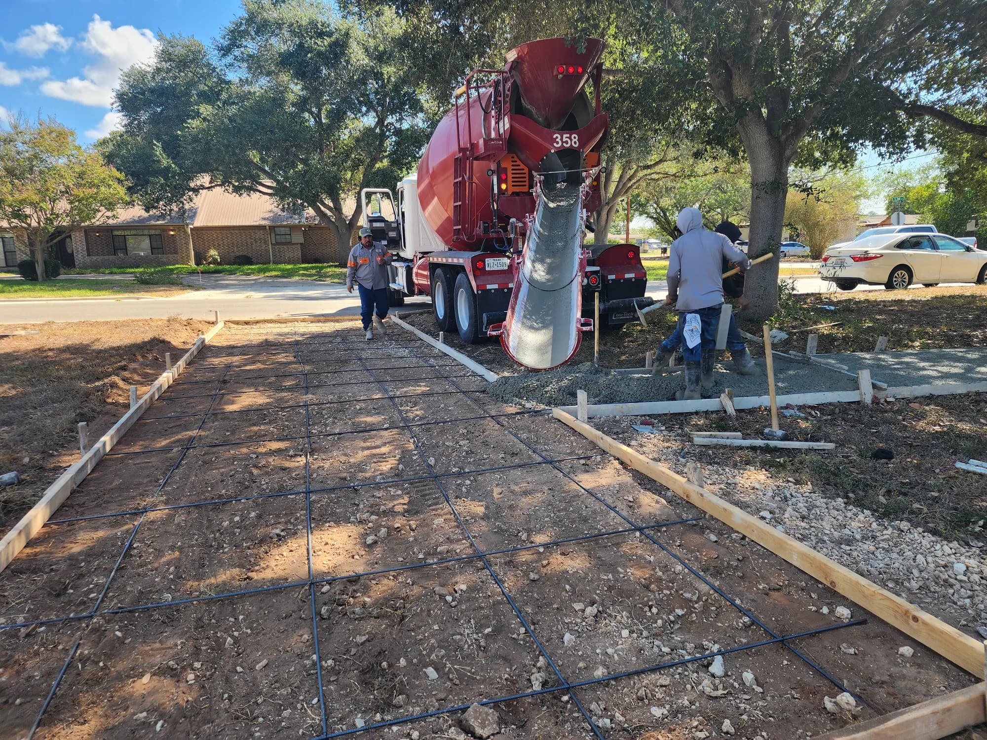 Concrete truck and Sanders & Co crew arriving for a residential concrete pour